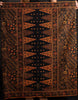 Woman holding a large patterned cotton batik sarong 